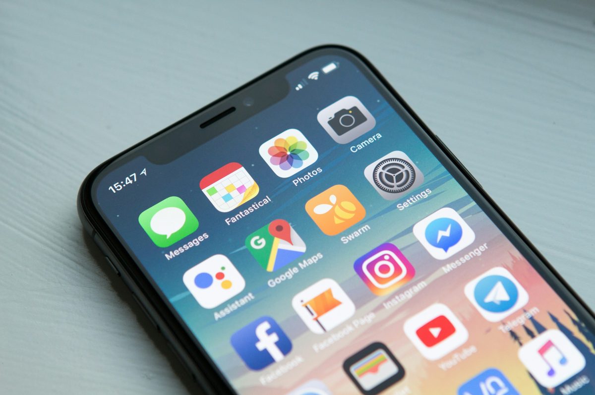 A smartphone showing a home screen of app icons.